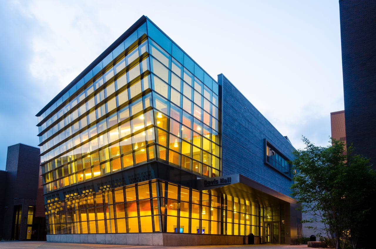 Davis Hall, home of the UB School of Engineering and Applied Sciences, lit up at dusk
